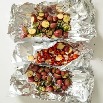 3 different foil packs of potatoes.