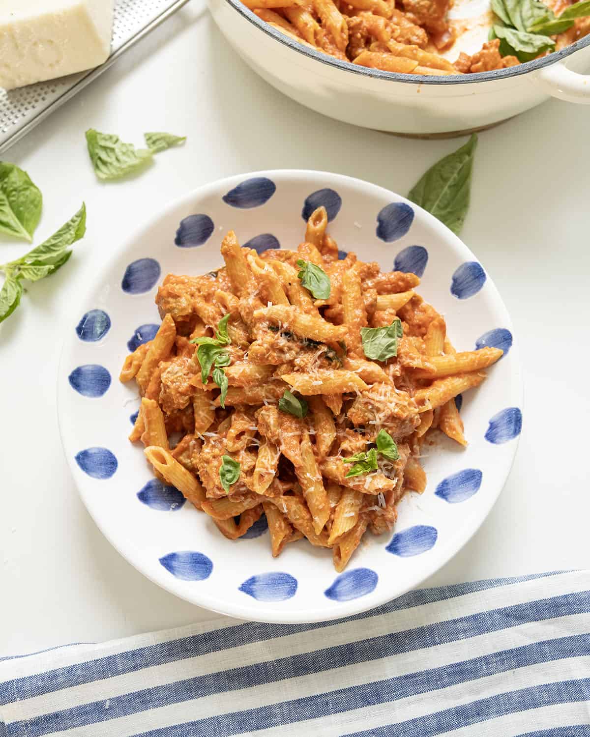 Pink sauce with penne on a plate.