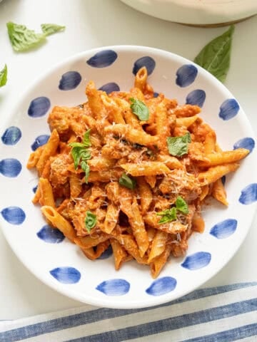 Pink sauce with penne on a plate.