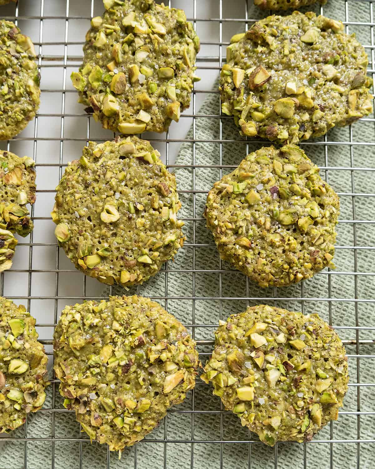 Italian pistachio cookies on a cooling rack.