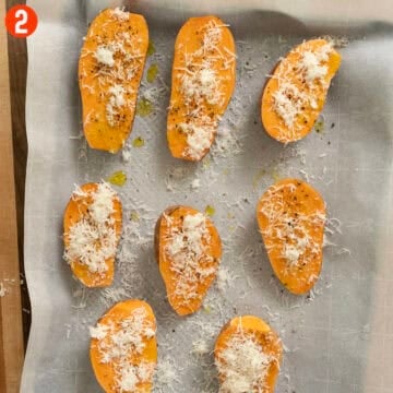 Sweet potato halves drizzled with olive oil and topped with salt, pepper, and parmesan.