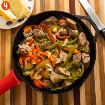 Sausage combined in with peppers and onions in the cast iron.