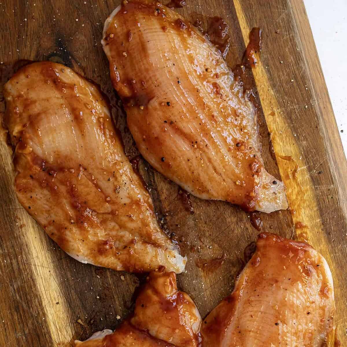 Chicken dressed in bbq sauce.