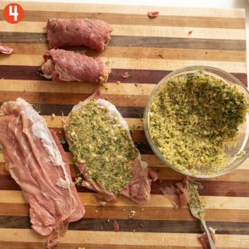 Rolling prosciutto and breadcrumb mixture in the beef cutlet.