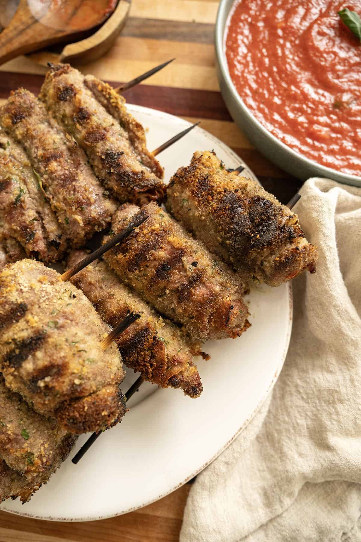 Grilled beef spiedini and marinara sauce. 