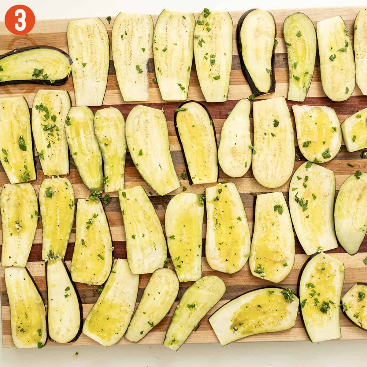 Eggplant slices brushed with marinade.