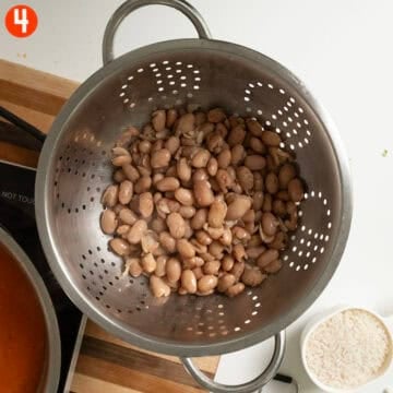 Draining borlotti beans.