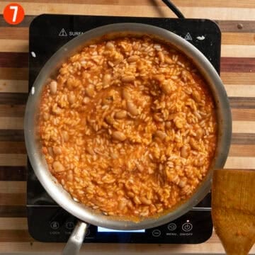 Combining rice with beans and marinara sauce.