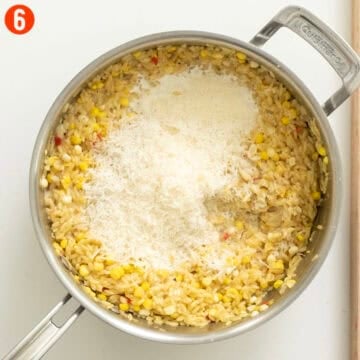 Corn Orzo combined with parmigiano in a saucepan.