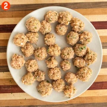 Chicken meatballs rolled on a plate.