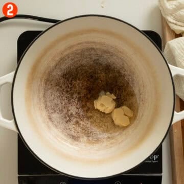Melting lard in a dutch oven.