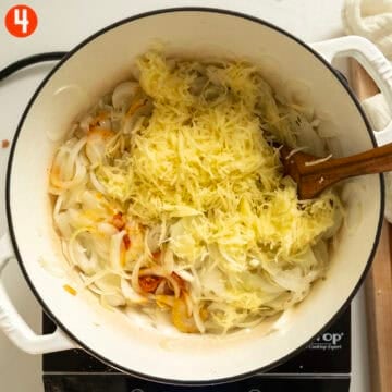 Grated potatoes and calabrian chili peppers added to the softened onions.