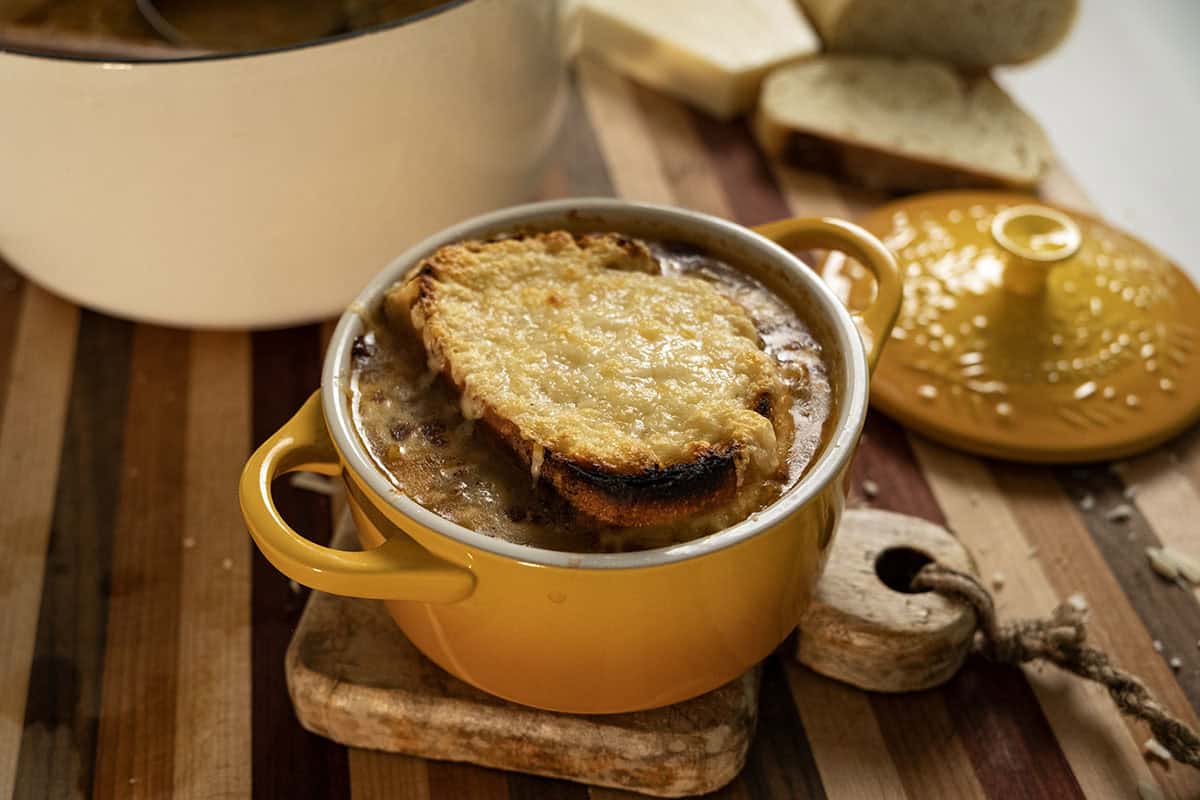 Licurdia soup in a bowl topped with bread and melted cheese. 