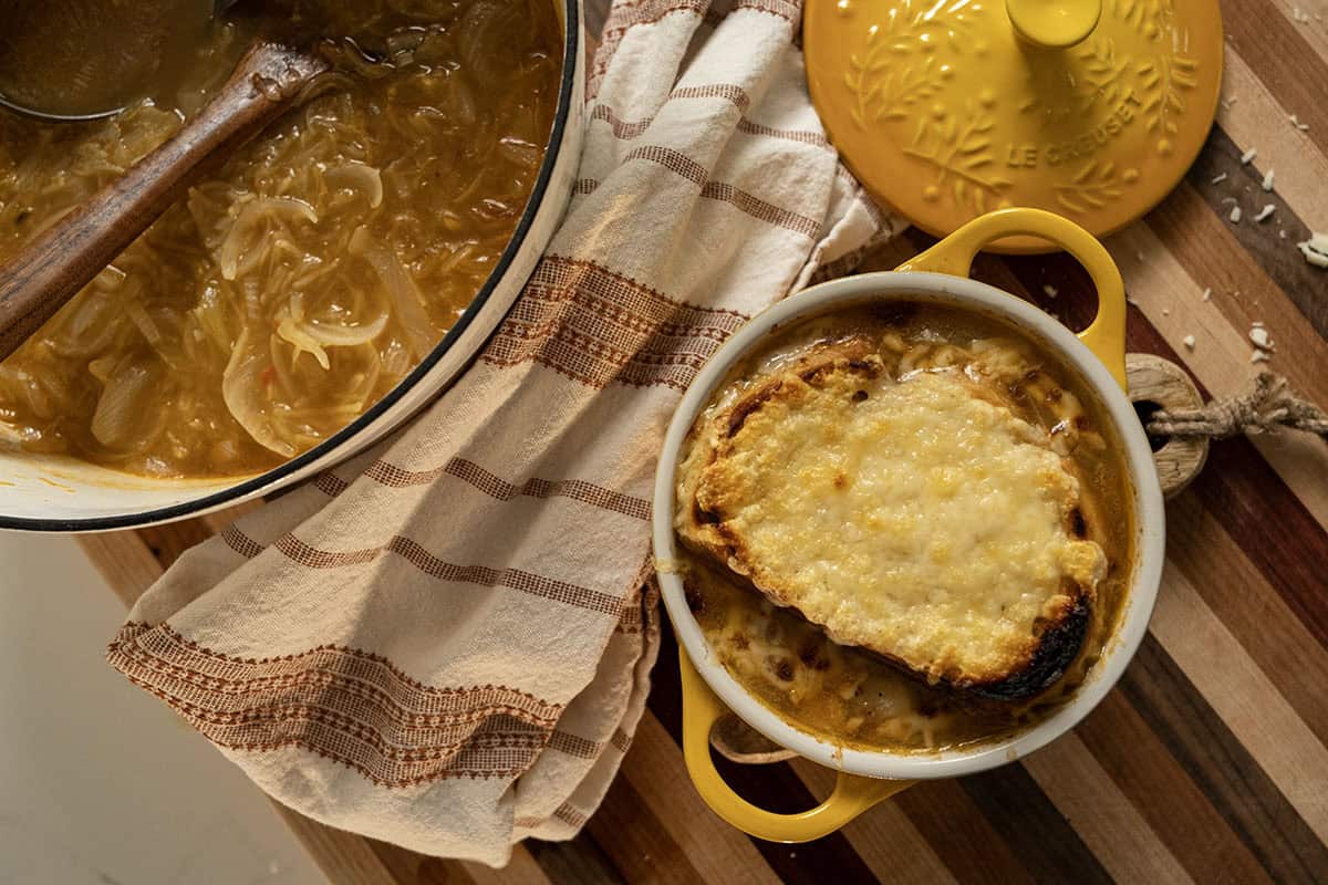 Licurdia soup in a bowl topped with bread and melted cheese.