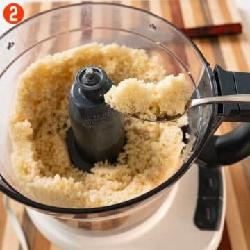 Almond paste and granulated sugar in a food processor.