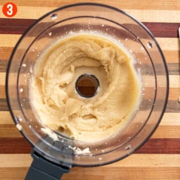 Pignoli cookie dough in a food processor.