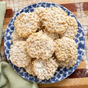 Pignoli cookies on a plate.