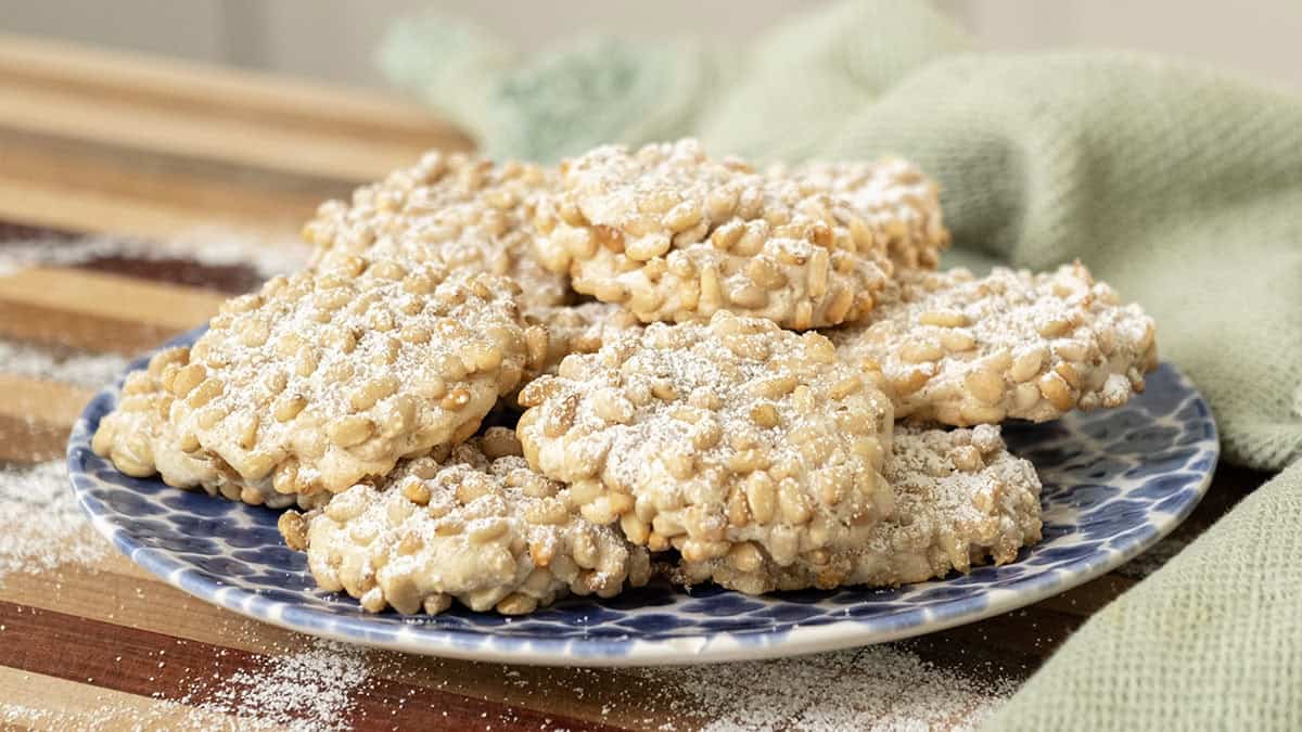 Pignoli cookies on a plate.