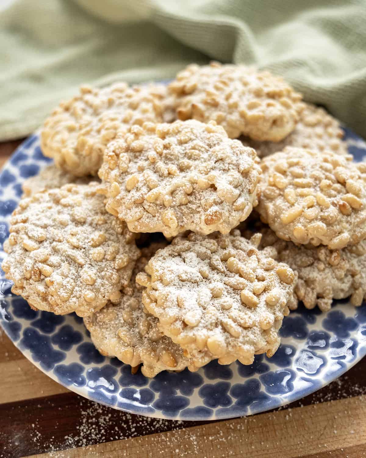 Pignoli cookies on a plate.