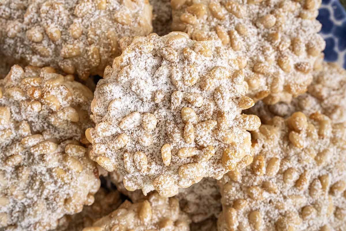 Pignoli cookies on a plate.