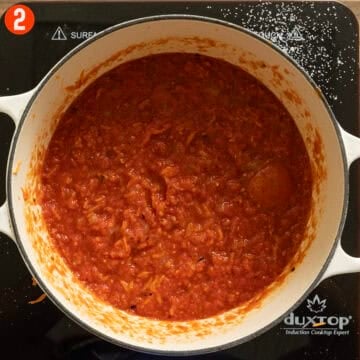 Crushed tomatoes coming to a simmer.