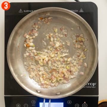 Sauteing shallots and garlic in butter.