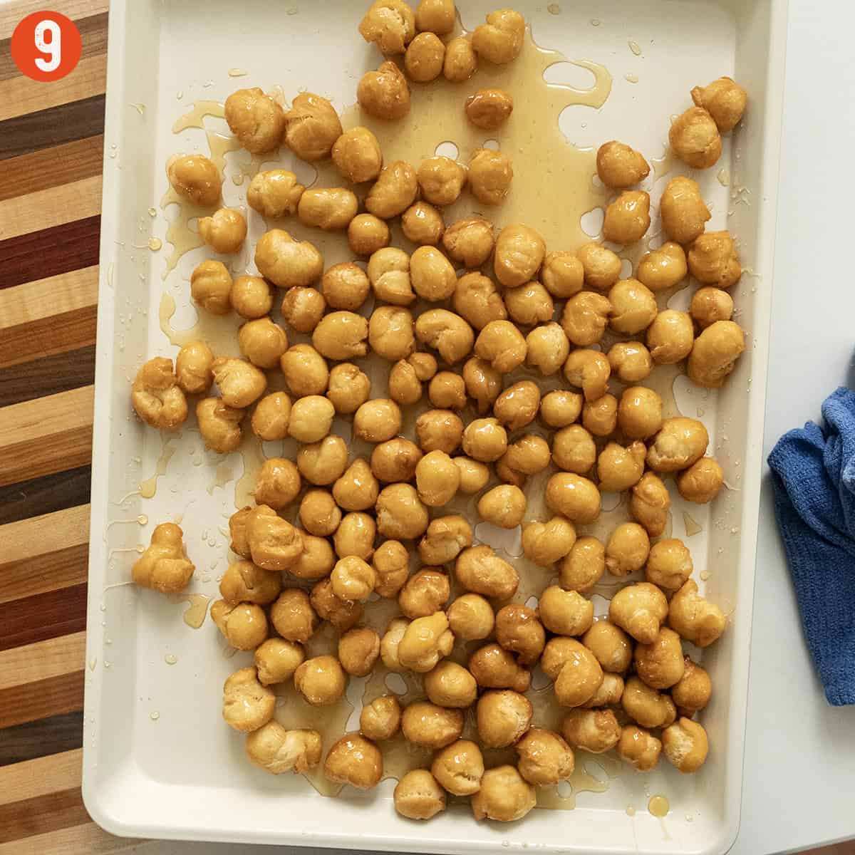 Tossing dough balls with honey.