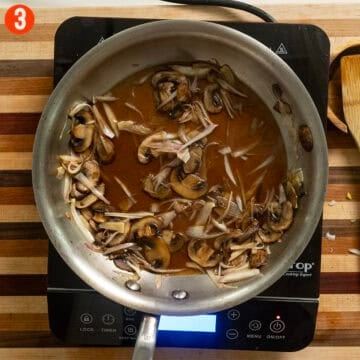 Simmering mushrooms and shallots in marsala wine.