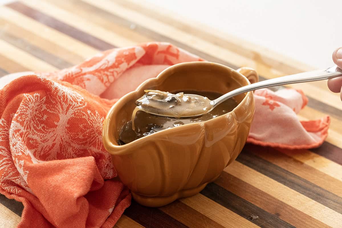 Mushroom marsala gravy in a gravy boat. 