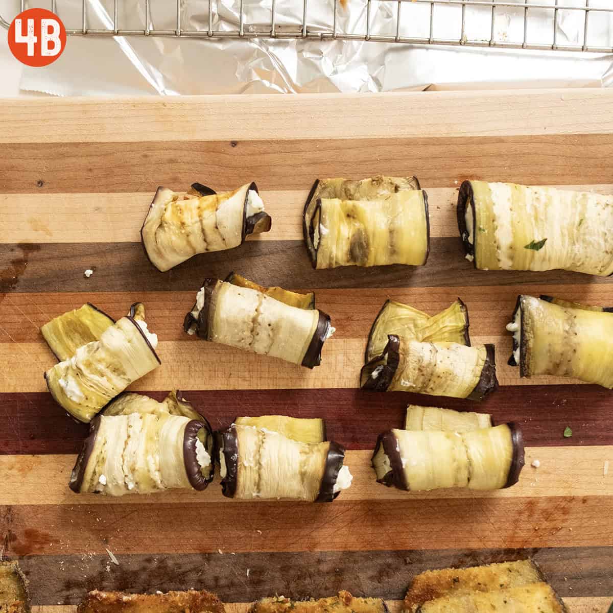 Rolled eggplant with ricotta sealed with the seam down.