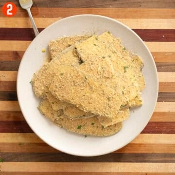 Eggplant dipped in egg and breaded.