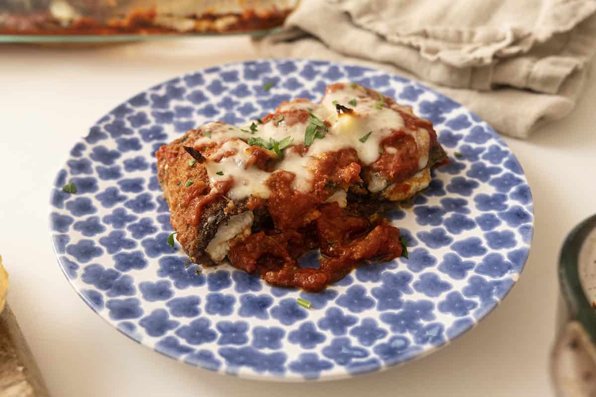 Eggplant Rollatini on a plate with melted mozzarella.