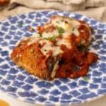 Eggplant Rollatini on a plate with melted mozzarella.
