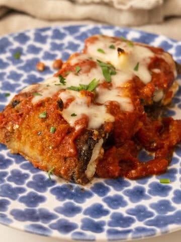 Eggplant Rollatini on a plate with melted mozzarella.
