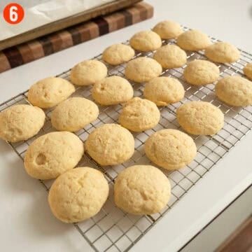 Lemon ricotta cookies resting on a cooling rack.