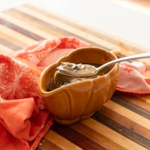 Mushroom marsala gravy in a gravy boat.